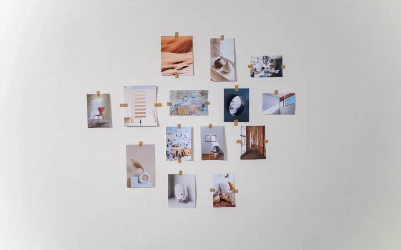 Aesthetic arrangement of photos on a white wall in a minimalist style.