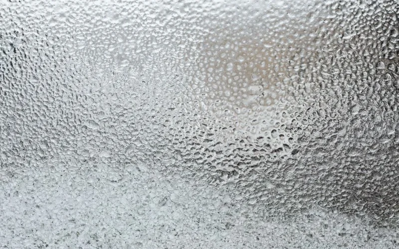 A detailed view of a frosted glass surface, capturing the icy texture and winter ambiance.