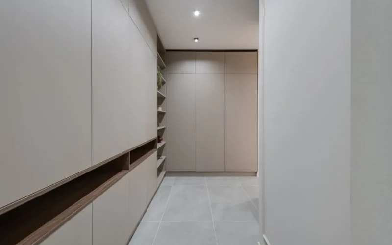 Explore a contemporary minimalist hallway featuring sleek modern cabinetry and neutral colors.