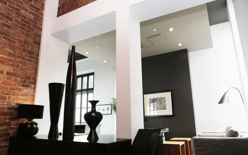 Sleek and modern loft with contemporary interior decor, featuring exposed brick and elegant accents.