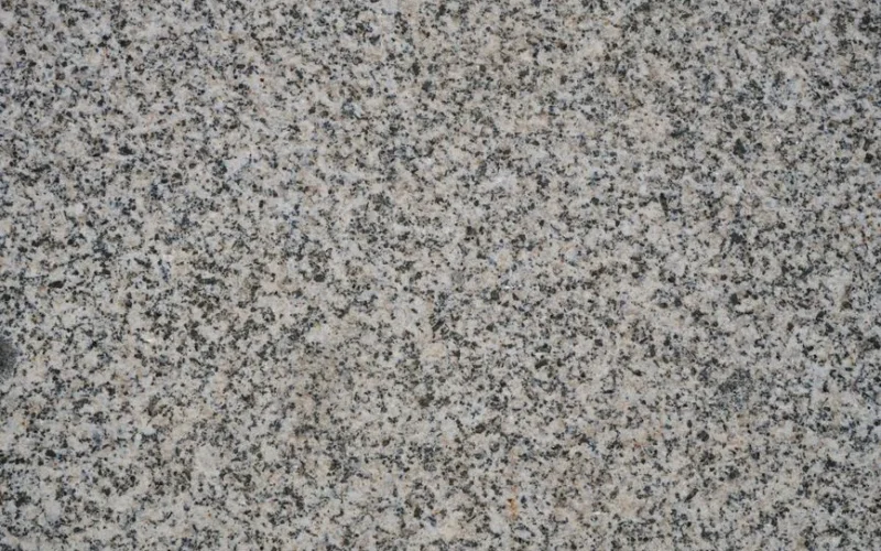 Close-up view of natural granite stone texture. Perfect for backgrounds or design projects.
