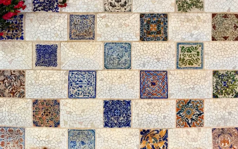 Colorful mosaic tile wall featuring intricate patterns and a Mediterranean style.