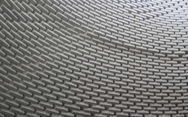Abstract view of a wavy brick wall showcasing intricate architecture and design.