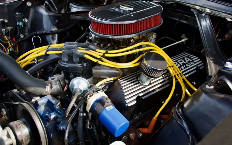 Detailed close-up of a Ford engine showcasing components and vibrant wiring.