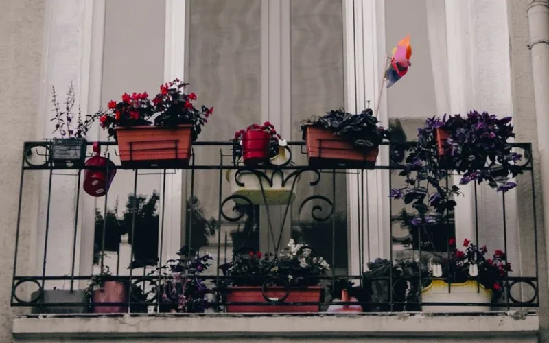 A picturesque balcony in Istanbul adorned with colorful potted plants, adding a touch of nature.
