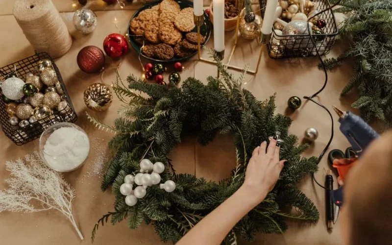 Create a festive Christmas wreath with ornaments and cookies for holiday decor.