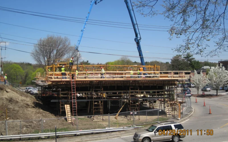 On April 29, 2001, a major step in the Wellesley Heavy Lift Rapid Bridge Replacment Project was completed. As shown in this picture, work crews poured the concrete for the replacement superstructure. The concrete will cure completely, and finishing elements will be added the superstructure this spring. During the fourth of July weekend this summer, crews will move the superstructure into place during a 72-hour closure of the bridge and immediate sections of Route 9 and Cedar Street. Route 9 will be detoured around the work zone via the existing on and off ramps. The bridge will be completed with a veryshort period of impact, due to the innovative construction technique being used by MassDOT. In contrast, convention methods would have resulted in a two-year-long project with lengthy lane closures. To view the Route 9 and Cedar street detour routes or to learn more about this project, visit <a href="http://www.massdot.state.ma.us/highway/abp/wellesleyBridge.aspx" rel="nofollow">www.massdot.state.ma.us/highway/abp/wellesleyBridge.aspx</a>